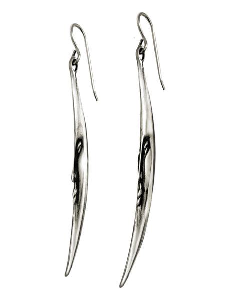 earings in the shape of a crescent moon with a smile face