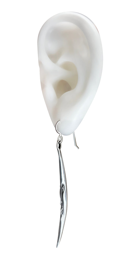 earings in the shape of a crescent moon with a smile face