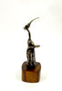 Bronze sculpture of a hummingbird  figure with a long neck on a wooden base 